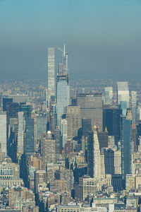 Modern buildings in city against sky