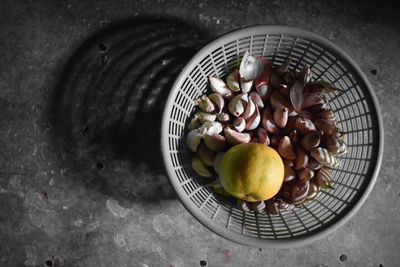 High angle view of fruits in basket on table