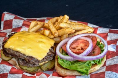 Close-up of hamburger and french fries in paper plate