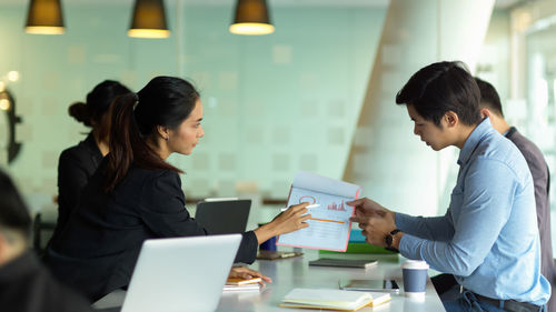 Business persons brainstorming at office