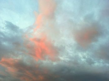 Low angle view of cloudy sky at sunset