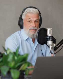 Portrait of senior man using mobile phone