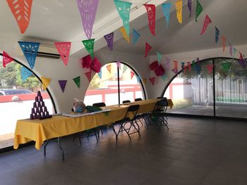 Multi colored chairs on table