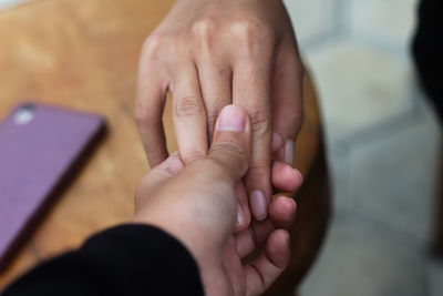 Midsection of woman using mobile phone