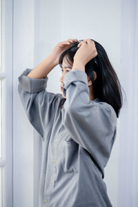 Side view of woman using mobile phone