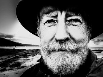 Close-up portrait of mature man with beard