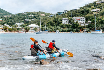 People in boat on river