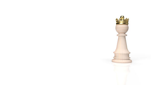 Close-up of chess pieces against white background
