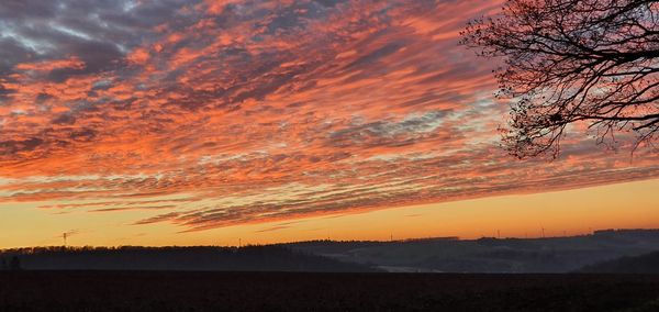Scenic view of dramatic sky during sunset