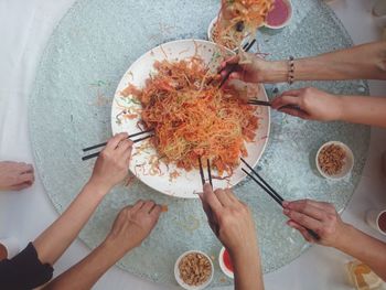 High angle view of people having noodles