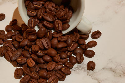 Close-up of coffee beans on table