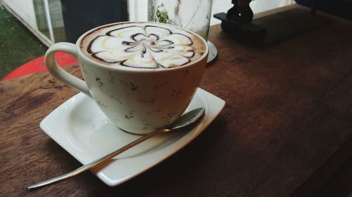 Close-up of coffee cup on table