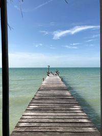 Pier over sea against sky