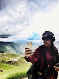 Young woman looking at mountain landscape