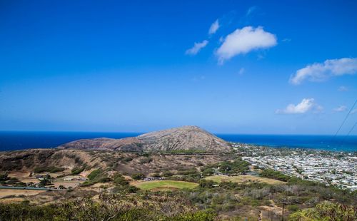 Scenic view of sea against blue sky