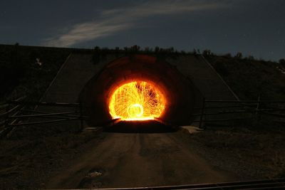 Sunset seen through tunnel