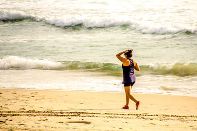 Woman standing at beach