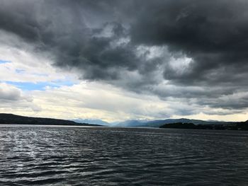 Scenic view of sea against cloudy sky