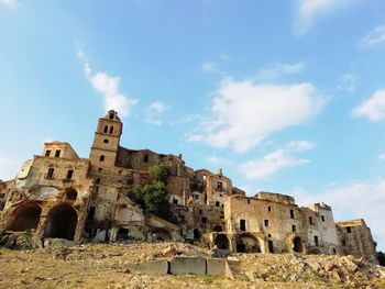 Low angle view of old building against sky