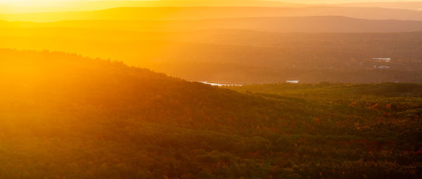 Scenic view of landscape against sky during sunset