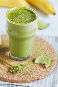 Close-up of green smoothie on table