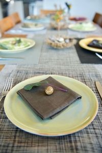 High angle view of easter egg on brown napkin in plate