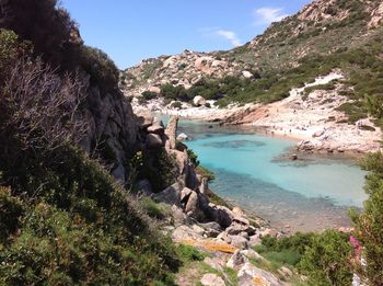 Scenic view of sea with mountain range in background