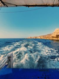 Scenic view of sea against clear blue sky