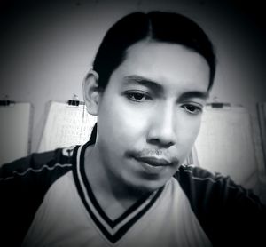 Portrait of young man at home