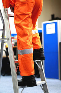 Worker climbing stairs wearing safety shoes