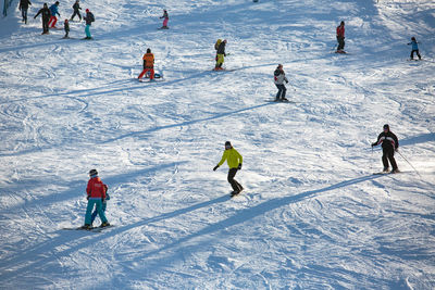 High angle view of people skiing on snow