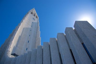 Low angle view of buildings against blue sky