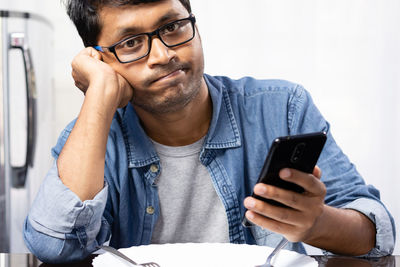 Young man using mobile phone