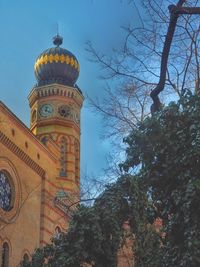 Low angle view of built structure against blue sky