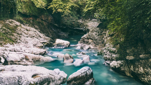 Scenic view of river amidst rock formation