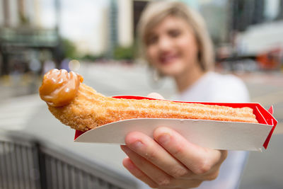 Close-up of woman holding ice cream