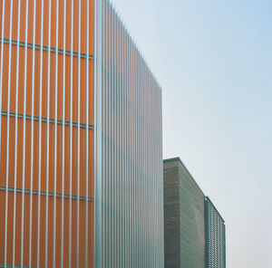 Low angle view of modern building against clear sky