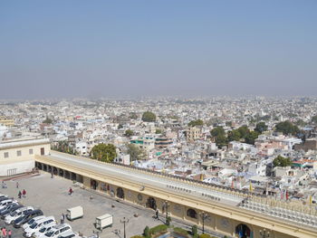 High angle view of buildings in city against clear sky