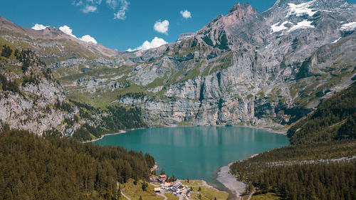 Scenic view of lake and mountains against sky