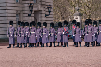 People in uniform marching 