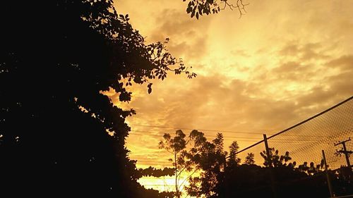 Low angle view of cloudy sky at sunset