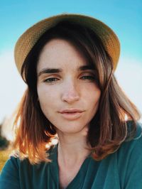 Close-up portrait of woman wearing hat