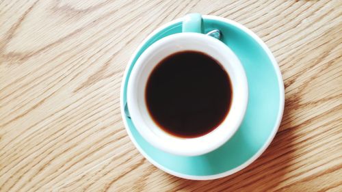 High angle view of black coffee on table