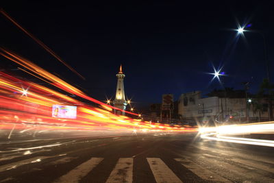 Light trails on city street at night