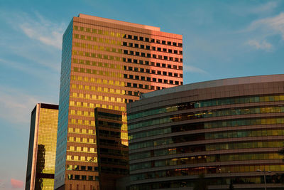 Low angle view of modern buildings against sky