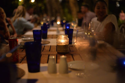 Close-up of wine glasses on table