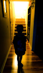 Boy standing in corridor