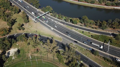 High angle view of highway by street in city