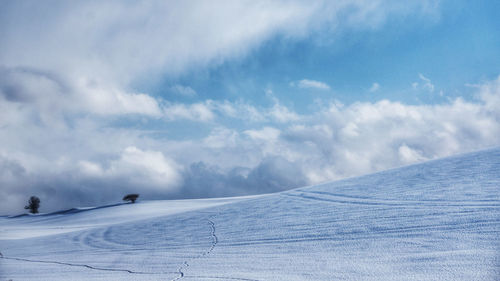 Scenic view of snow covered landscape against sky