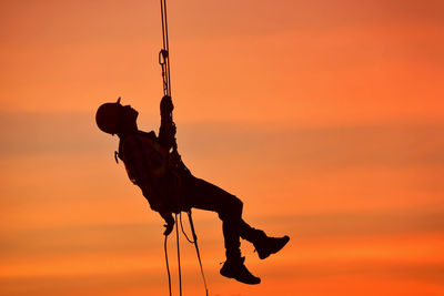 Working at heights in high visibility clothes and special safety harness